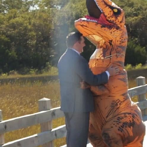 Bride big reveal in t-rex costume will melt your heart