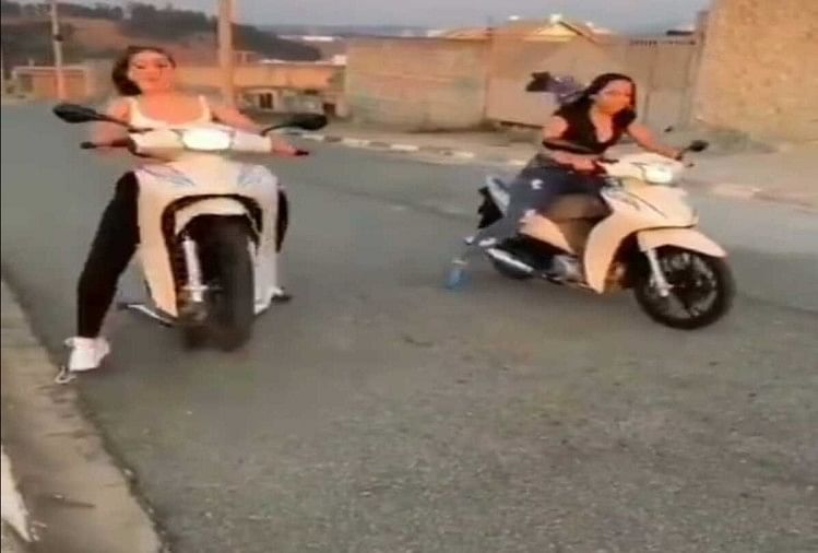 girl showing stunt with scooty then hit the cameraman video goes viral on social media
