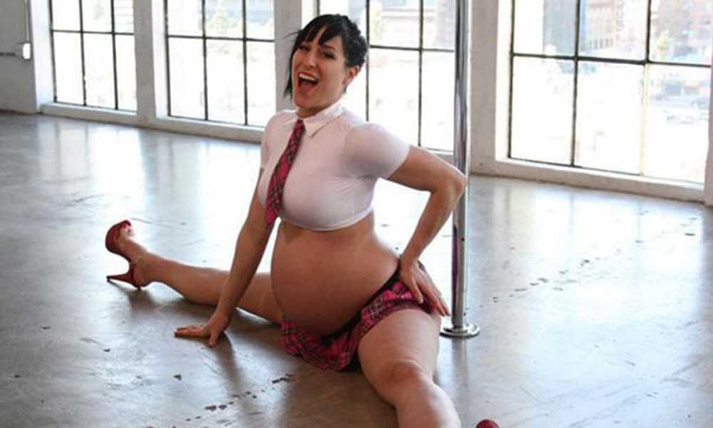 Pregnant Pole dancer poses sexy before delivery. 