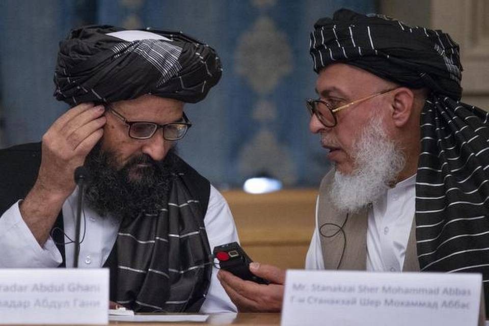 Mullah Abdul Ghani Baradar, the Taliban group's top political leader and Sher Mohammad Abbas Stanikzai