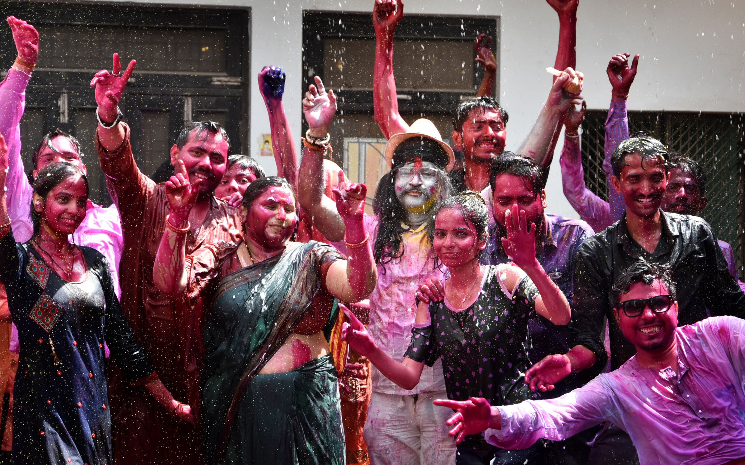 in the rain of coloures the body of people became wet in the rain of coloures the body of people became wet