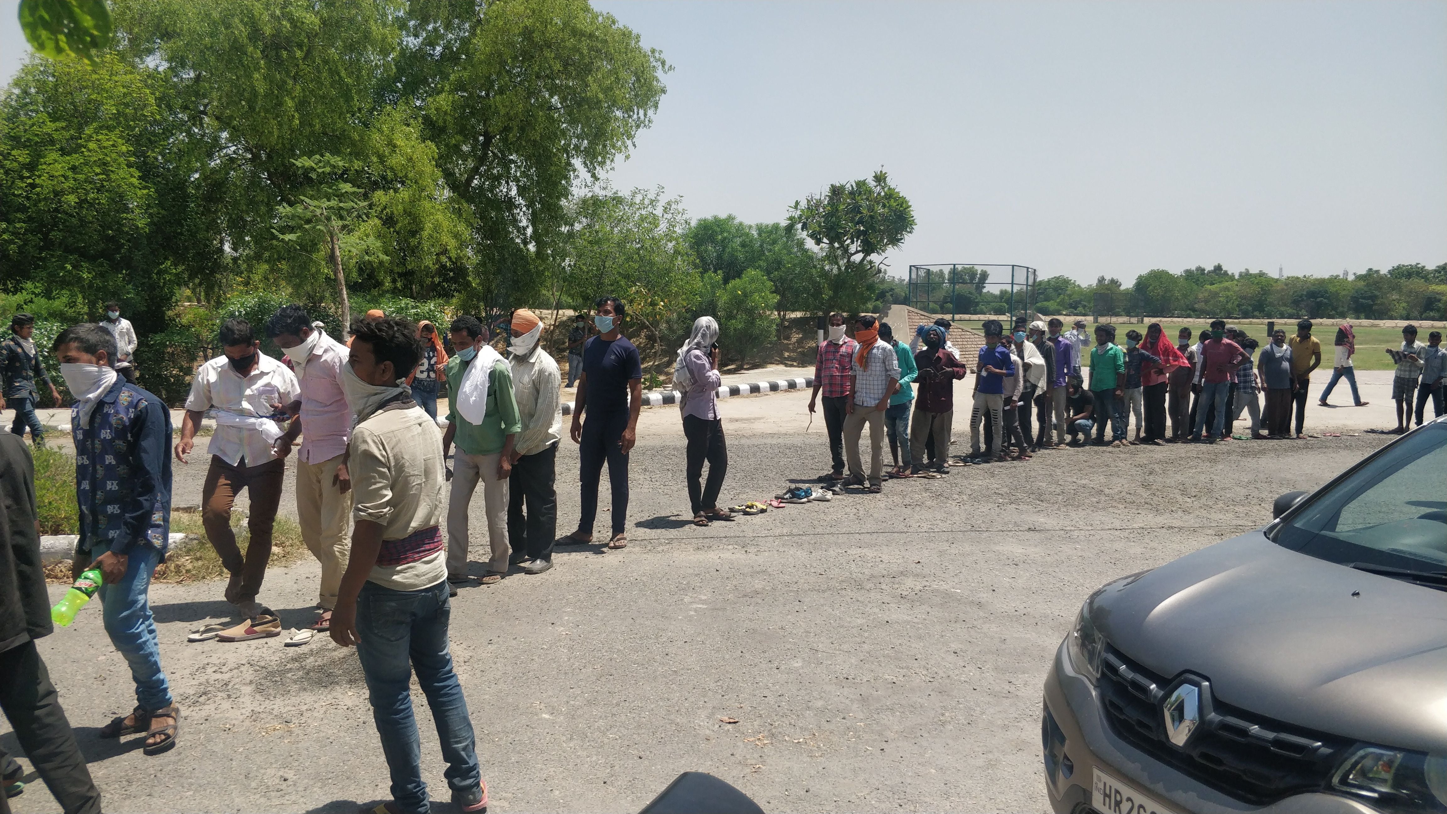 laborers in line since morning for screening laborers in line since morning for screening