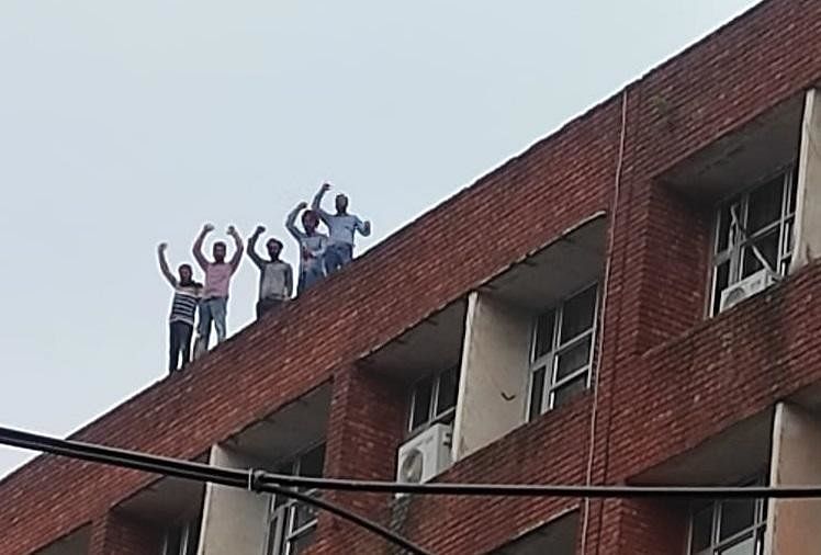 The teachers reached outside the education department's building in Mohali where five teachers climbed the 7th floor with petrol bottles. 