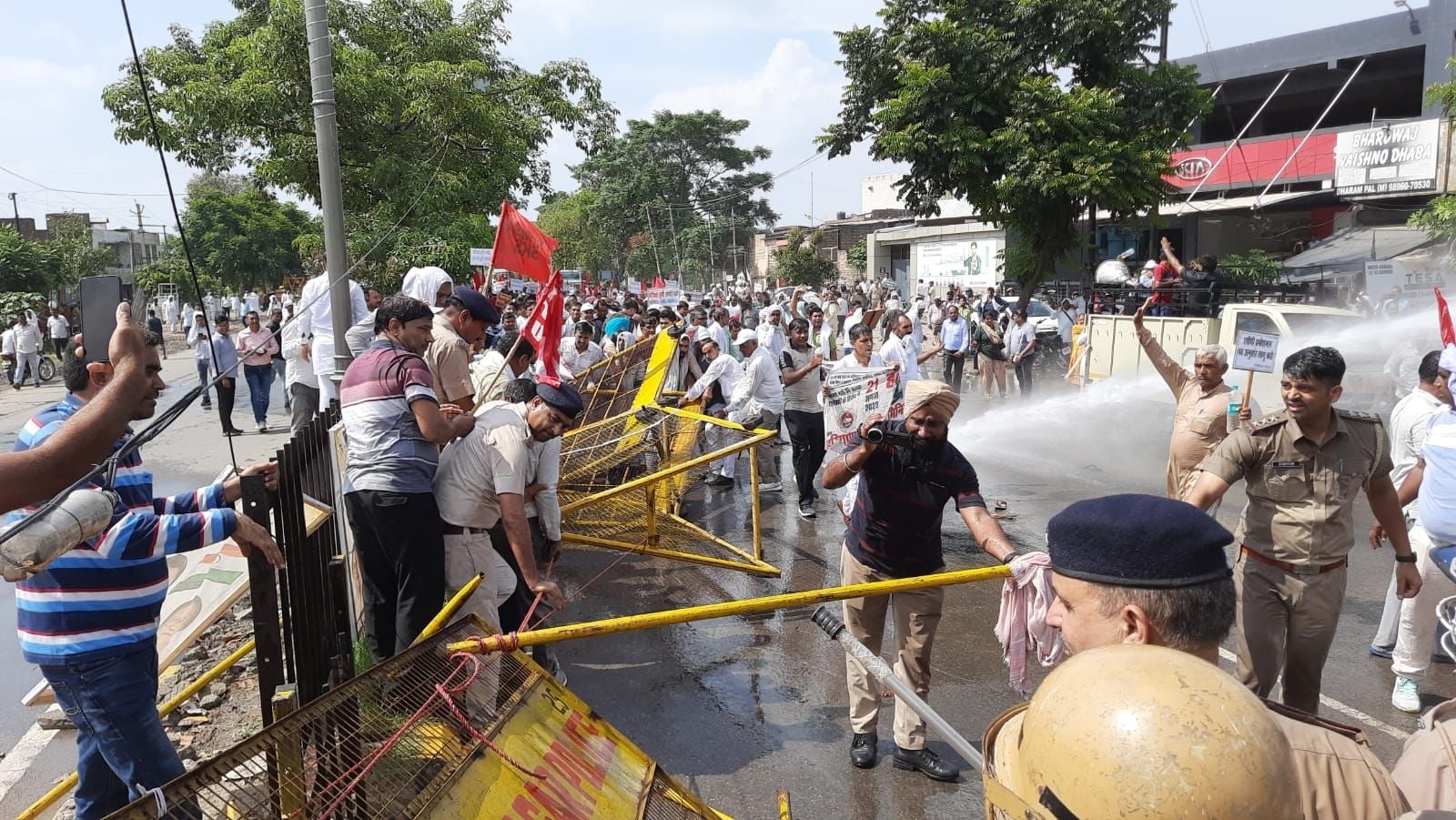 Water cannon used after clashes with protesters traveling to Education Minister's residence
