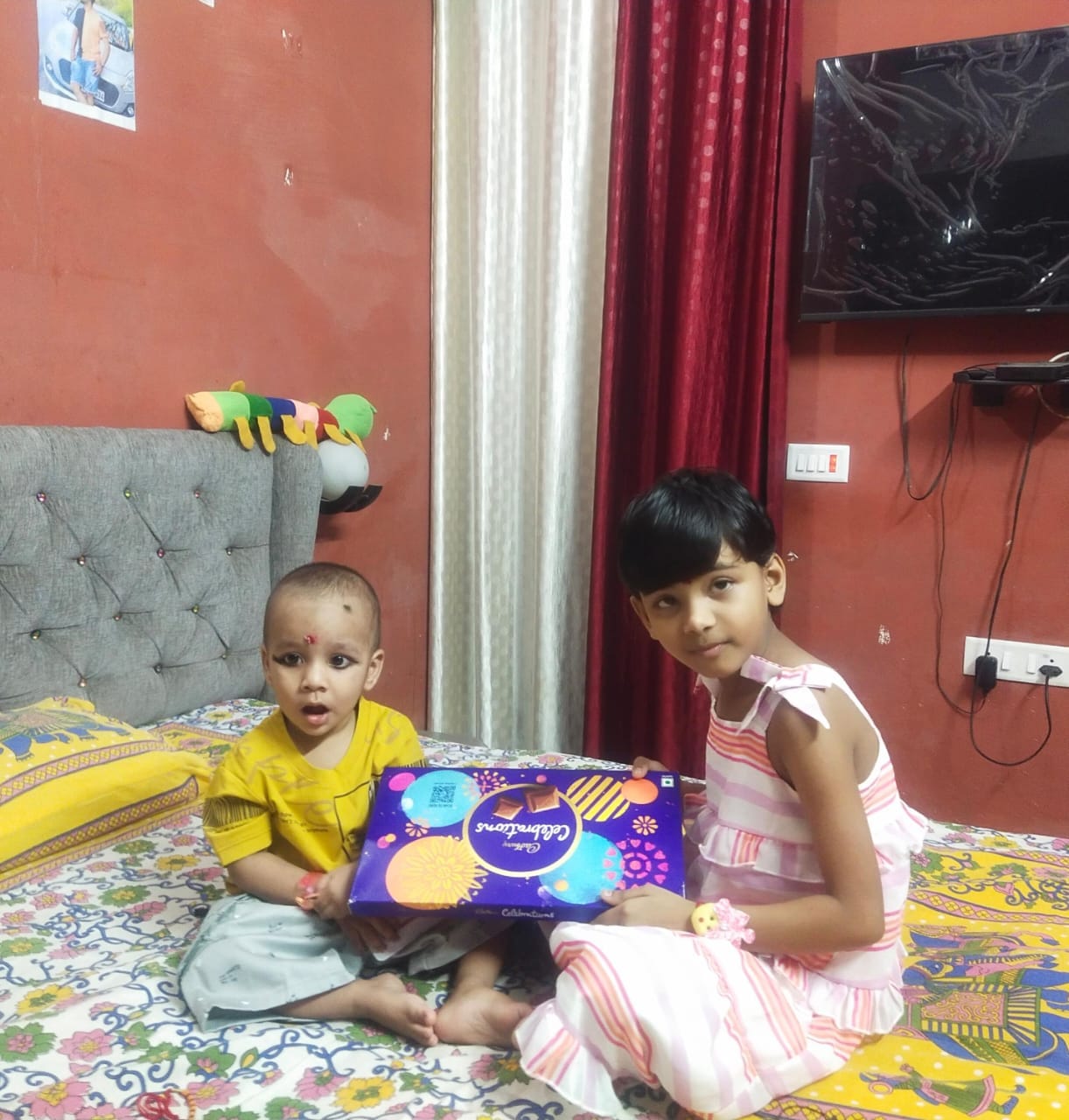 भाई के राखी बांधती बहन ।