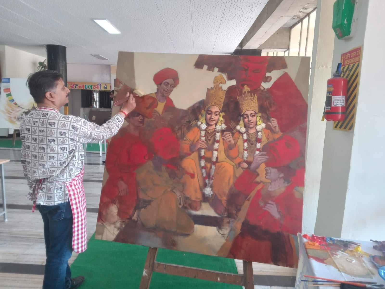 कुरुक्षेत्र। चित्रकारी करते हुए कलाकार। संवाद कुरुक्षेत्र। चित्रकारी करते हुए कलाकार। संवाद