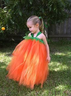Orange dress to a girl.