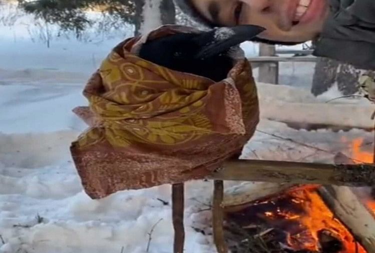 a boy save crow life shivering due to cold video viral goes on social media