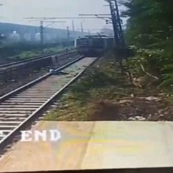 a person lay down on the railway track when train was coming in front him watch this viral video