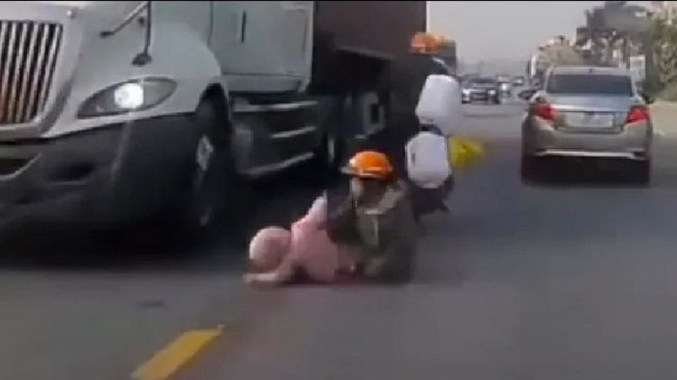 road accident video goes viral mother save son from getting crushed under a truck