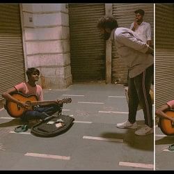 Roadside boy sings Punjabi song with guitar at Connaught Place Delhi