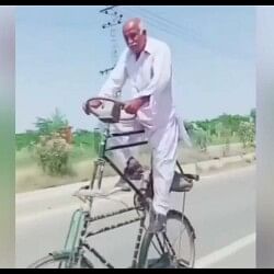 Jugaad Video Man riding on a double decker cycle on road video viral